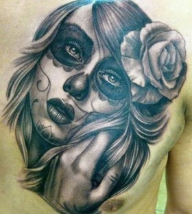Santa muerte girl with rose in hair tattoo on chest