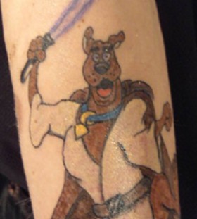 Scooby with a lightsaber tattoo
