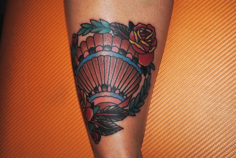 Shell and rose tattoo