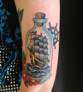 Ship in a bottle arm tattoo