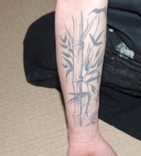 Simple bamboo arm tattoo