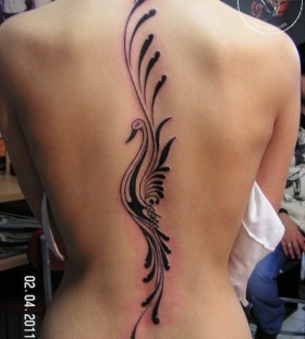 Simple bird's tribal bird tattoo