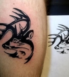 Simple black ink deer tattoo