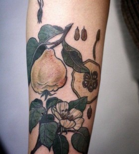 Simple green fruit tattoo