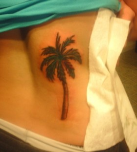 Simple palm tree back tattoo