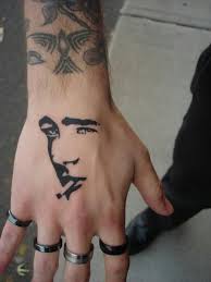 Simple smoking man hand tattoo