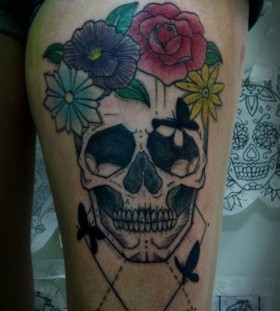 Skull and flowers tattoo by Tyago Compiani