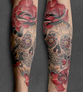 Skull and flowers tattoo by Pepe Vicio