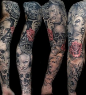 Skull and girls faces full arm tattoo