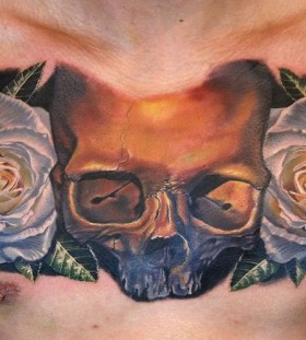Skull and roses chest tattoo by Phil Garcia