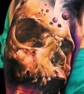 Skull and space tattoo by Florian Karg
