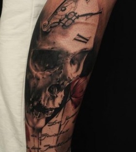 Skull clock arm tattoo