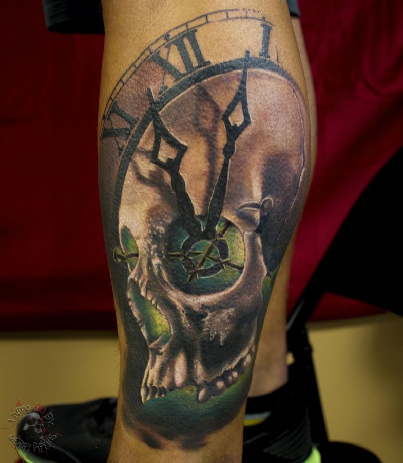Skull clock leg tattoo