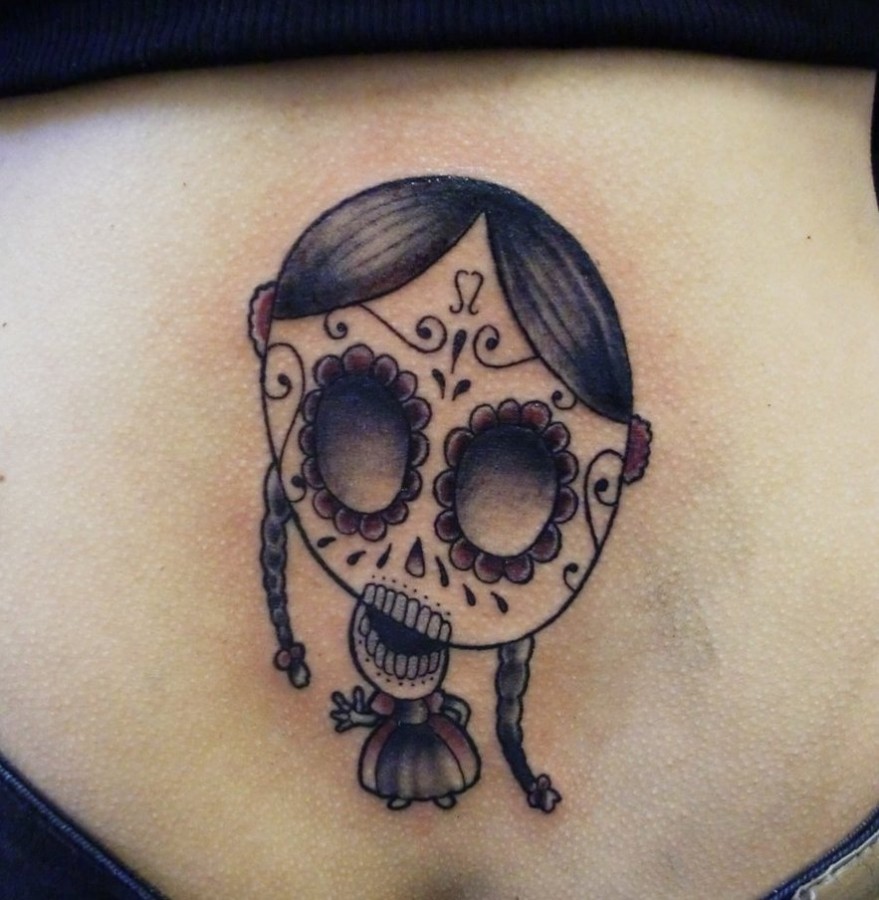Skull face doll tattoo