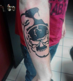 Skull grenade arm tattoo