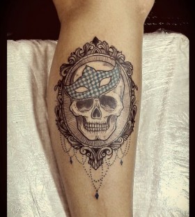 Skull in a frame tattoo by Tyago Compiani