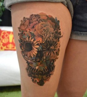 Skull of flowers leg tattoo