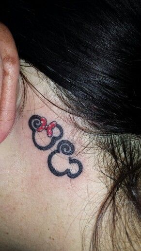 Small Minnie and Mickey behind ear tattoo