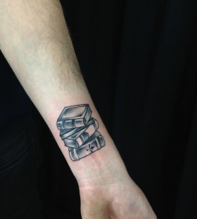 Small books tattoo by Kirsten Holliday