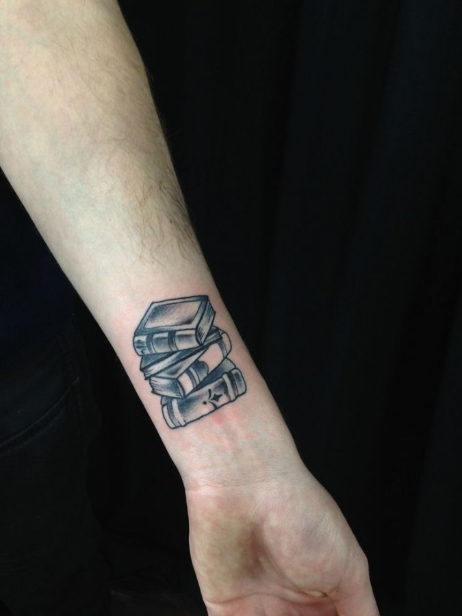 Small books tattoo by Kirsten Holliday