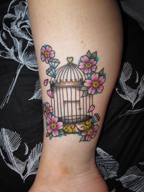 Small coloured birdcage and flowers tattoo