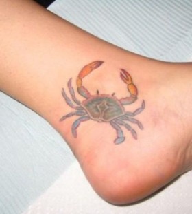 Small crab ankle tattoo
