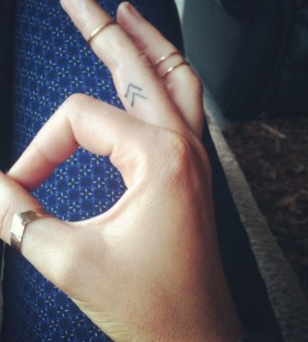 Small finger's tiny tattoo