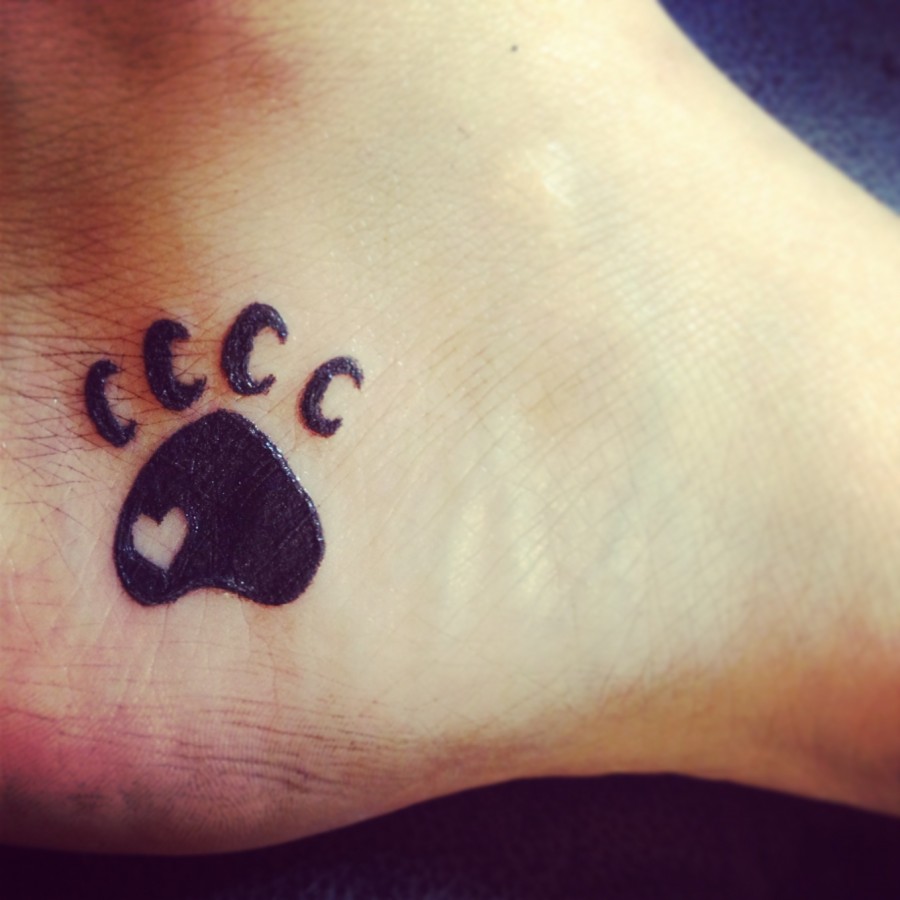 Small paw tattoo on foot