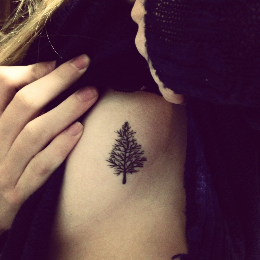 Small pine tree side tattoo