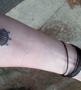 Small shell arm tattoo