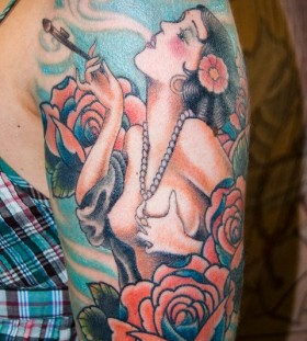 Smoking girl and flowers tattoo