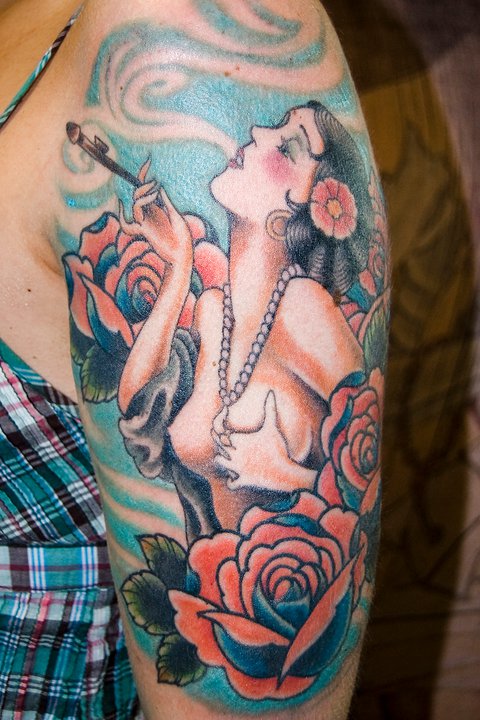Smoking girl and flowers tattoo