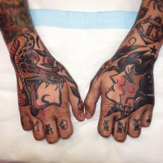 Snake and woman hand tattoos by James McKenna