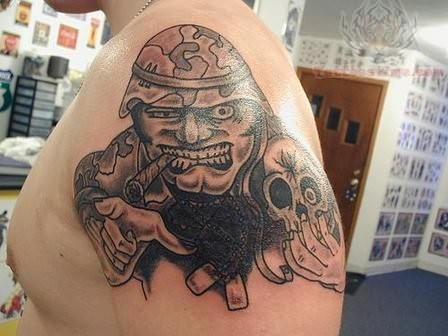 Soldier holding a skull tattoo
