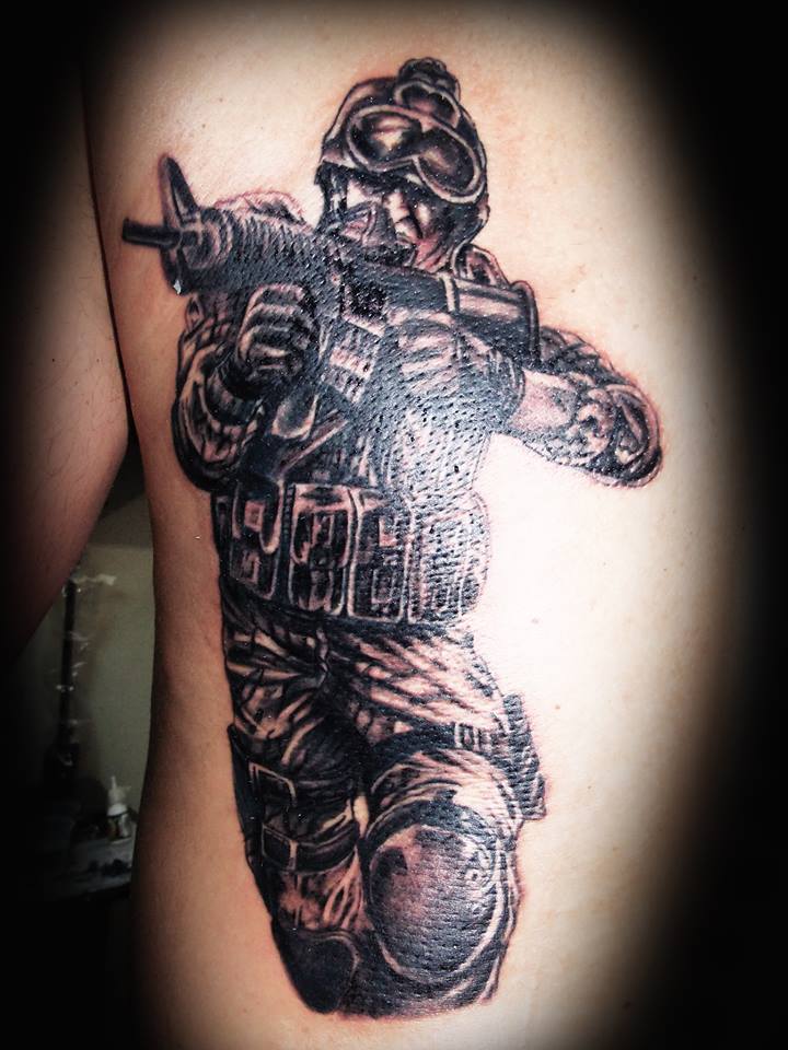 Soldier with a gun tattoo - | TattooMagz › Tattoo Designs / Ink Works