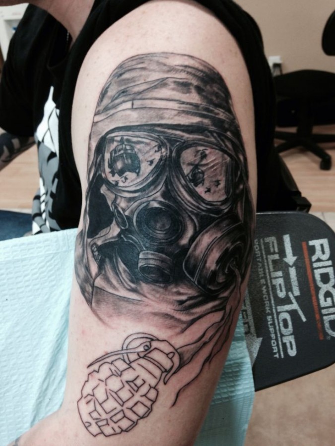 Soldier with gas mask tattoo