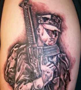 Soldier with gun tattoo
