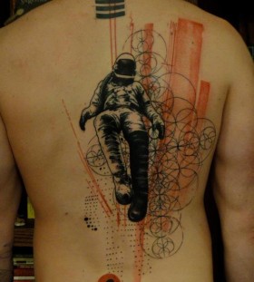 Spaceman xoil back tattoo