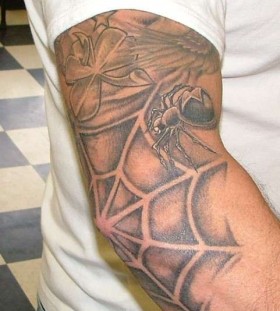 Spider web and crawling spider tattoo
