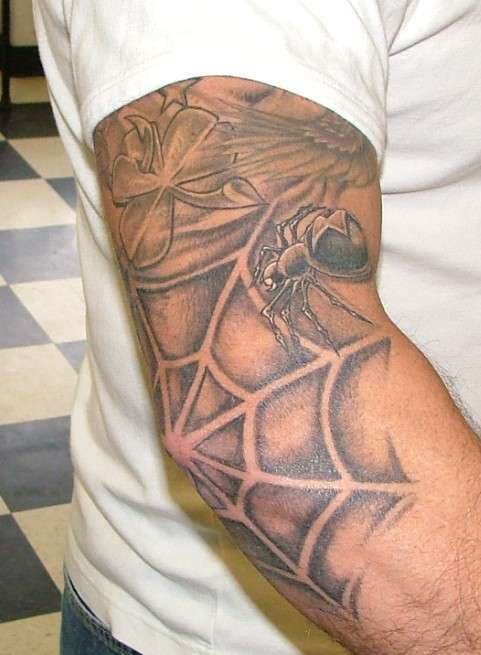 Spider web and crawling spider tattoo