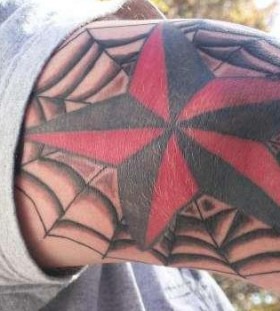 Spider web and star tattoo