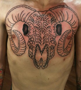 Spooky goat skull chest tattoo