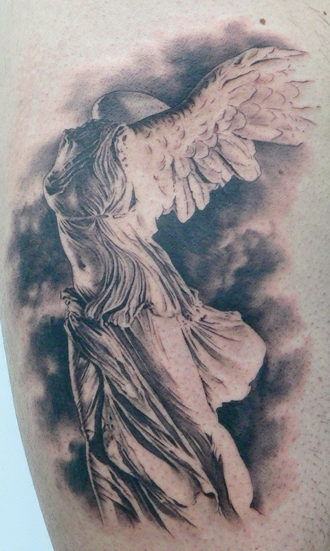 Statue tattoo by Xavier Garcia Boix