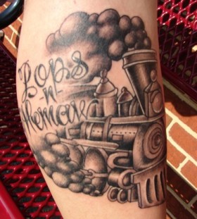 Steaming train leg tattoo