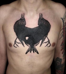 Strange raven chest tattoo
