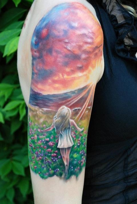 Stunning girl and sunset tattoo