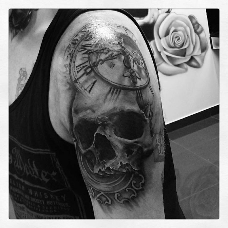 Stunning skull clock tattoo