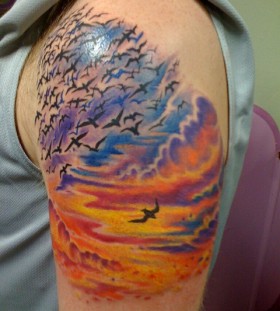 Sunset and birds tattoo