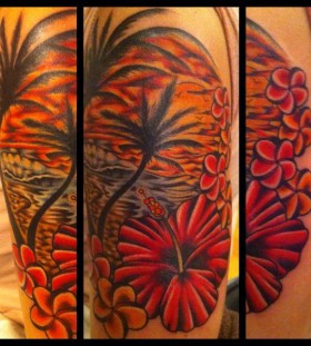 Sunset and flowers tattoo