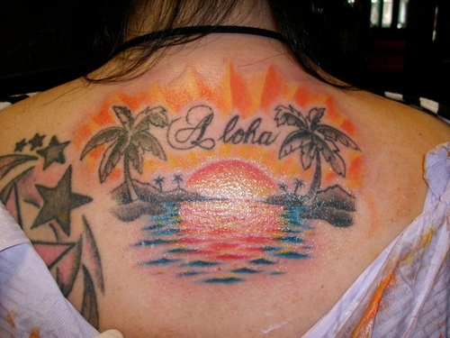 Sunset and palm tree back tattoo
